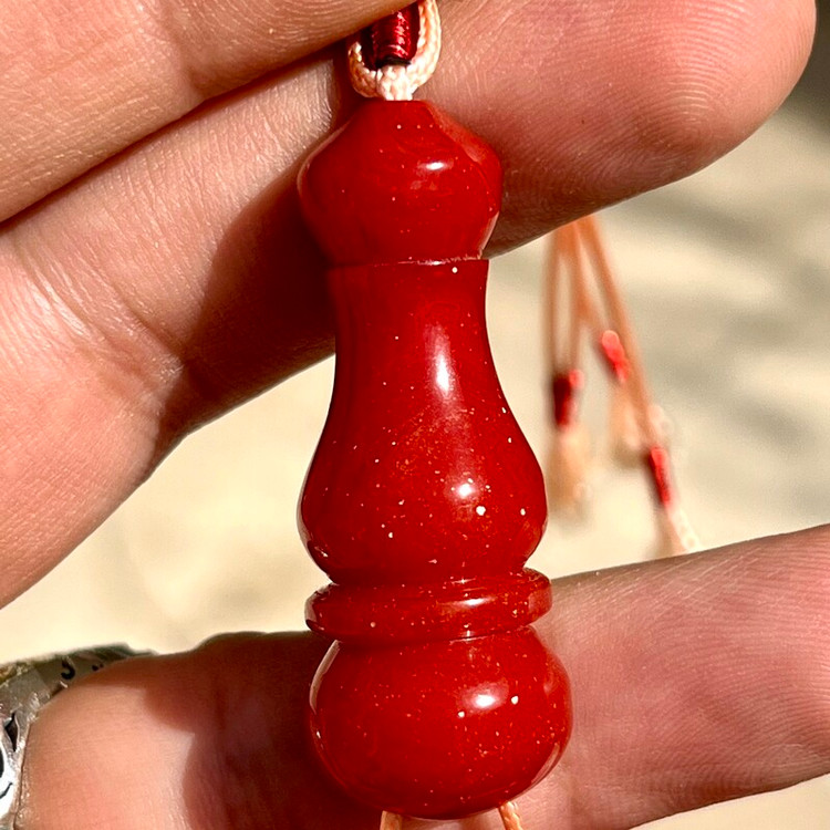 مشخصات قیمت و خرید تسبیح سندلوس زر افشان رنگ نارنجی تیره